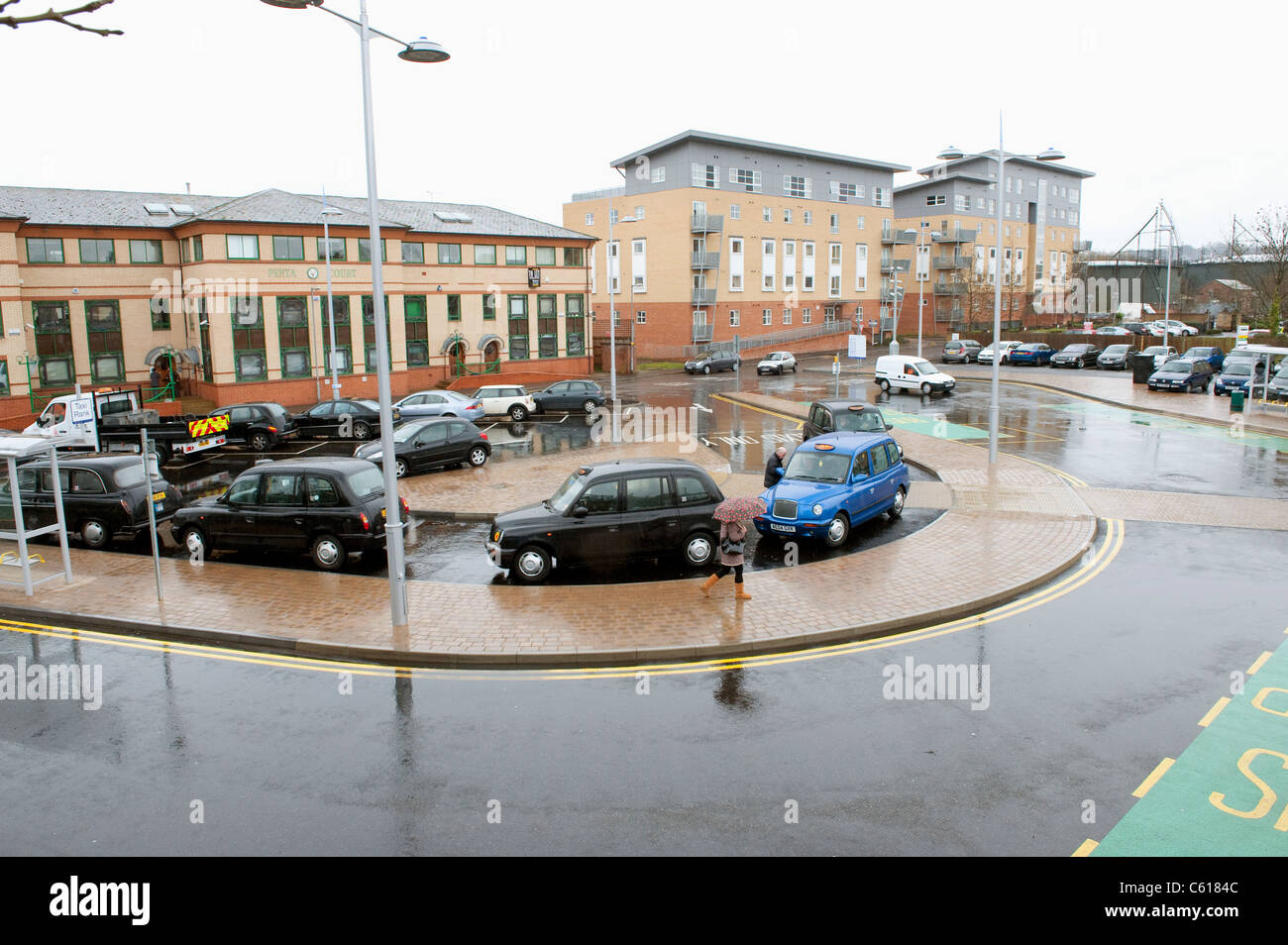 Taxis queuing at a taxi rank at Elstree and Borehamwood Station, England. Stock Photo