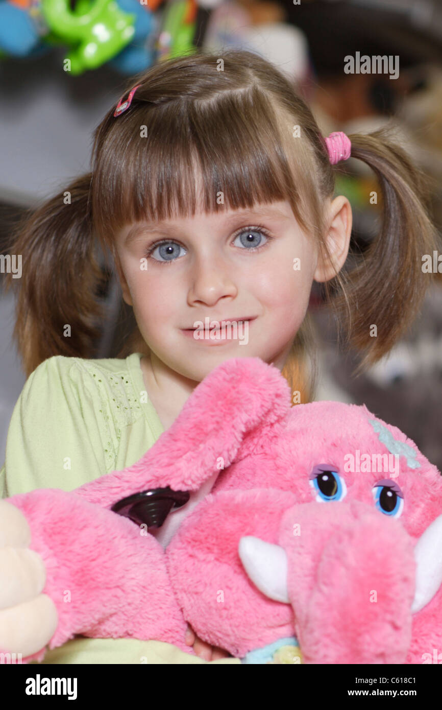 portrait of girl with a toy Stock Photo - Alamy