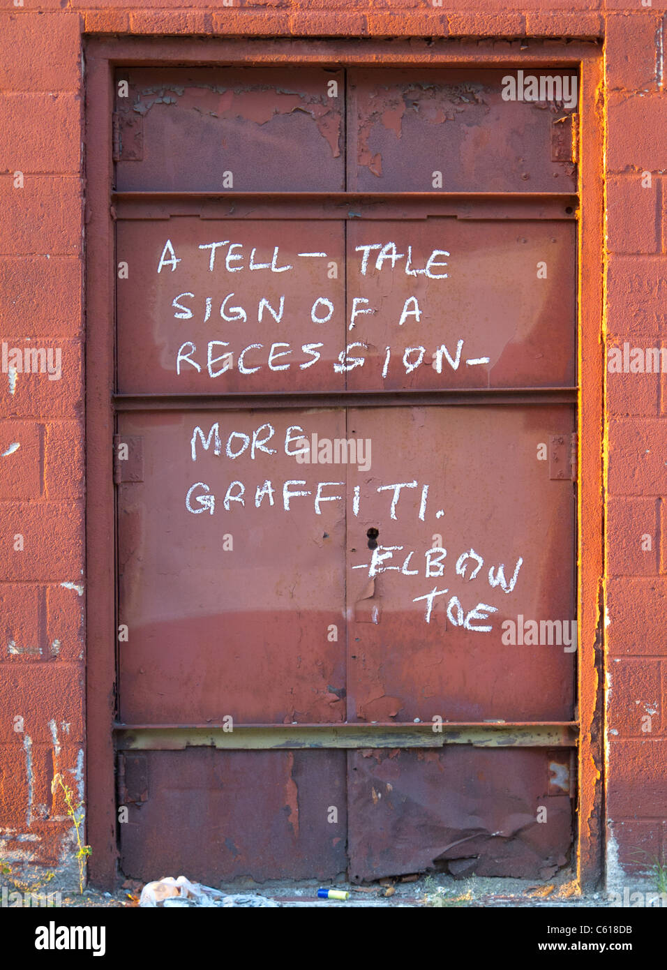 A tell tale sign of a recession more graffiti sign Stock Photo