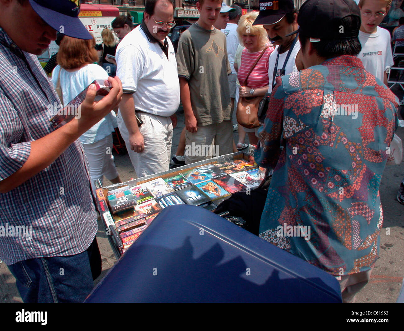 Vendors on Canal Street in Chinatown sell illegal copies copies of music CD's and DVD's and