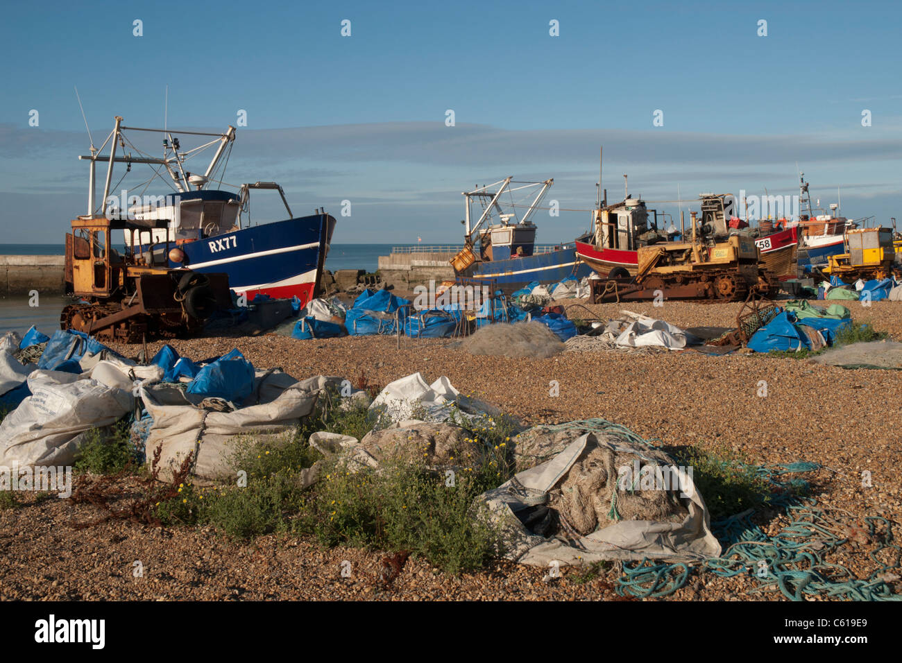 Hastings has the largest beach-based fishing fleet in England and the boats are moored on Harbour Beach. Stock Photo