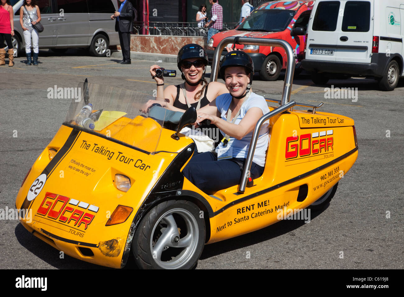 Spain, Barcelona, Tourists in Go Car Open Topped Vehicle Stock Photo