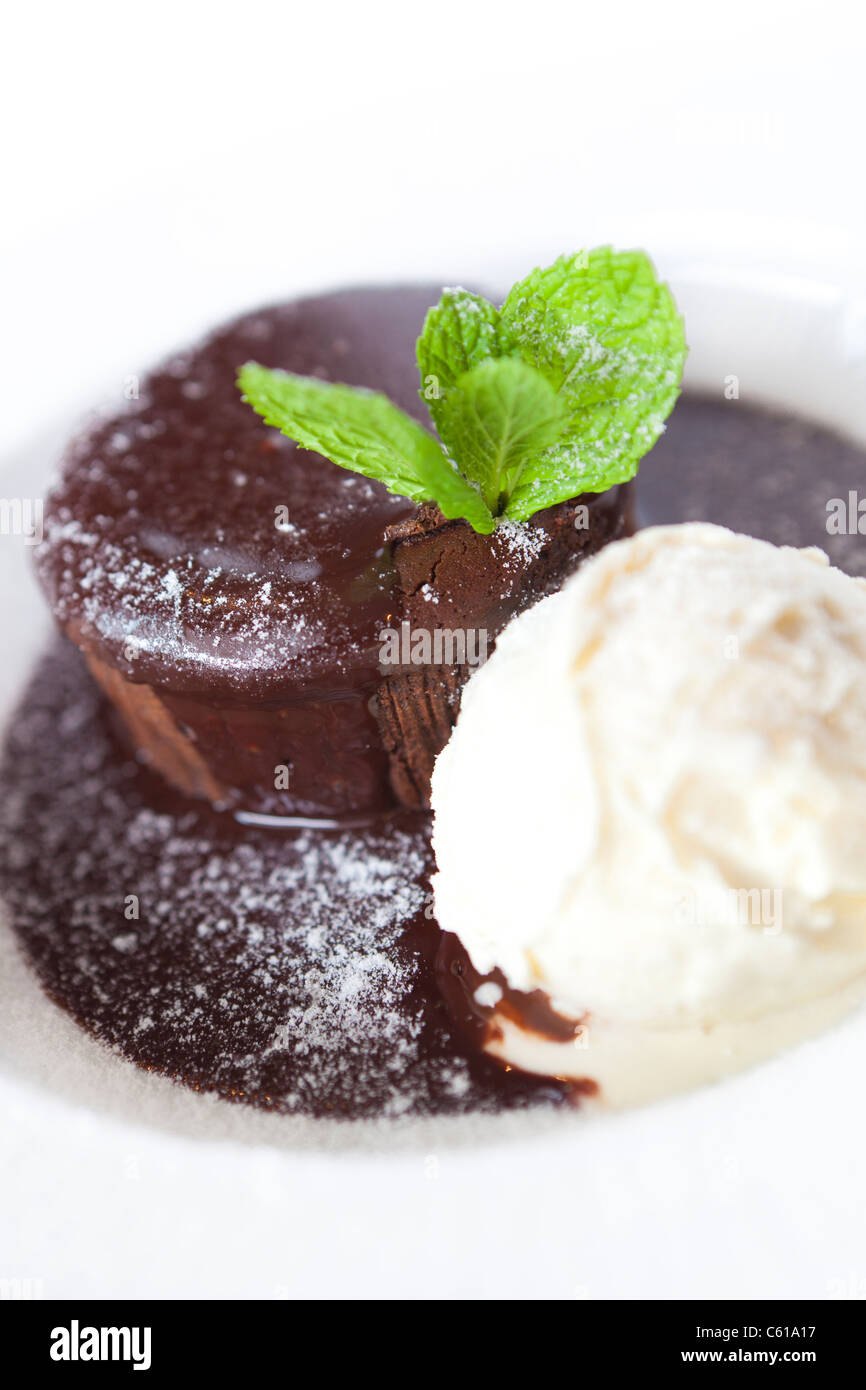 chocolate souffle with chocolate sauce and vanilla ice cream. Stock Photo