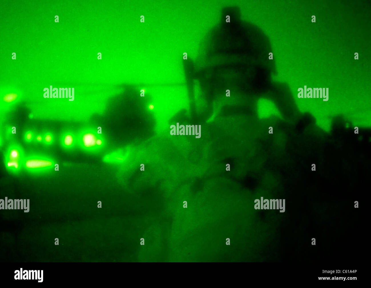 A U.S. Army special forces weapons sergeant, with Special Operations Task Force - South, adjusts his night-vision goggles before boarding an MH-47 Chinook helicopter en route to a village clearing operation in Shah Wali Kot district, Afghanistan, June 7, 2011. Operations such as these are conducted in order to deny Taliban influence and promote the government of Afghanistan, while providing security and stability throughout the province. (U.S. Army photo by Sgt. Daniel P. Shook/Released) Stock Photo