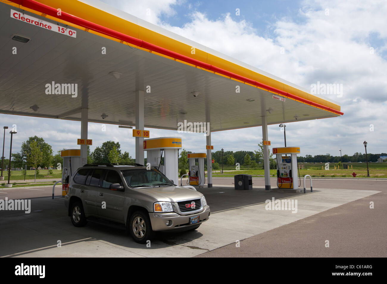 cars parked filling up at gas station iowa united states of america Stock Photo