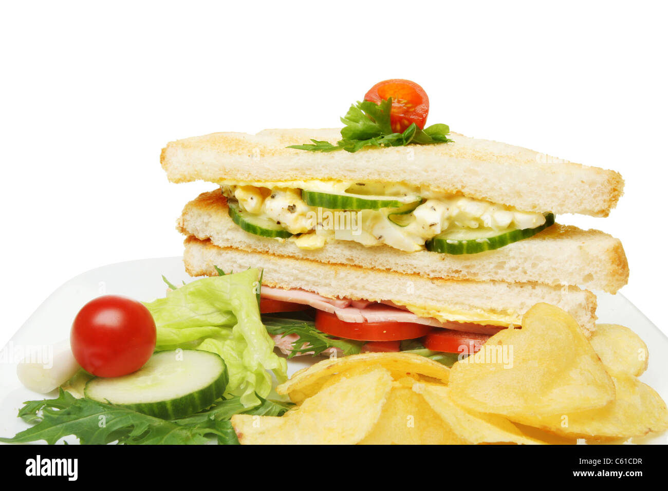 Closeup of a ham and egg club sandwich with garnish Stock Photo