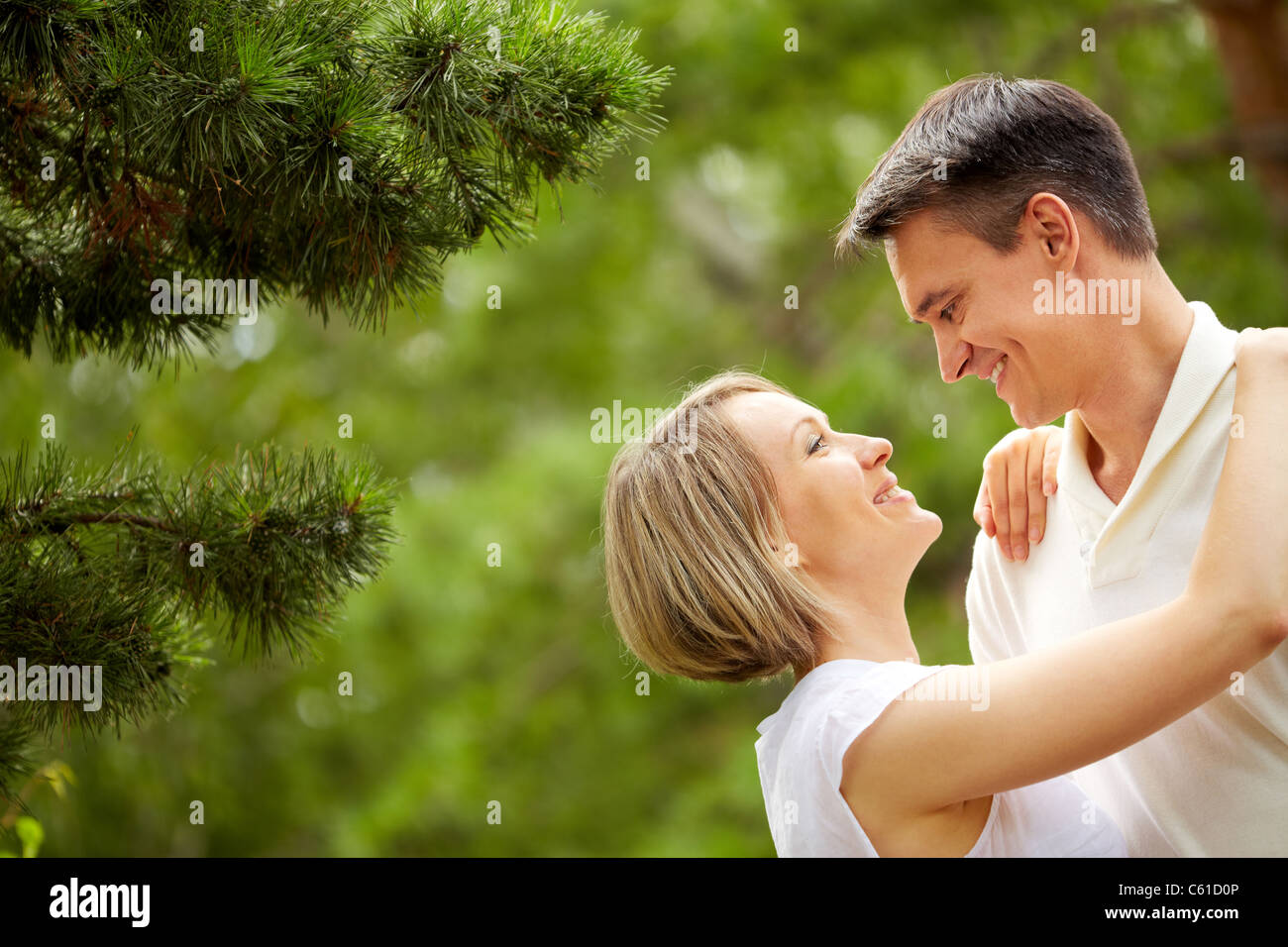 Portrait of young romantic couple looking at one another Stock Photo - Alamy Portrait of young romantic couple looking at one another Stock Photo - Alamy