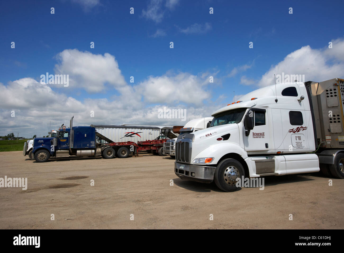 semi trucks parked at truck stop parking area in rural manitoba canada Stock Photo