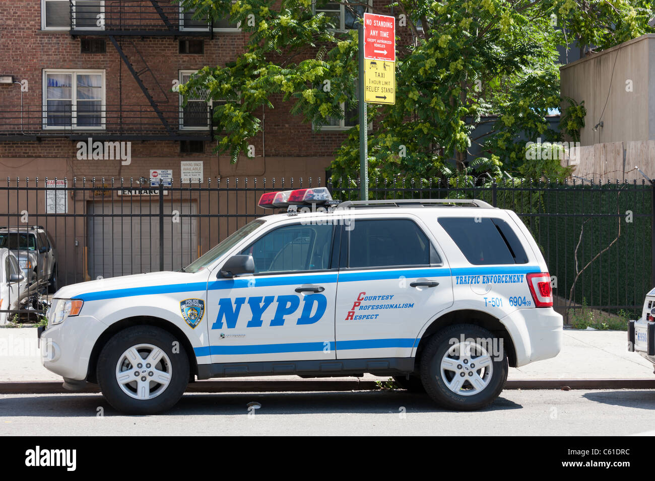 A 2009 Ford Escape hybrid car used by the NYPD Traffic Enforcement division parked on a city street in New York City. Stock Photo