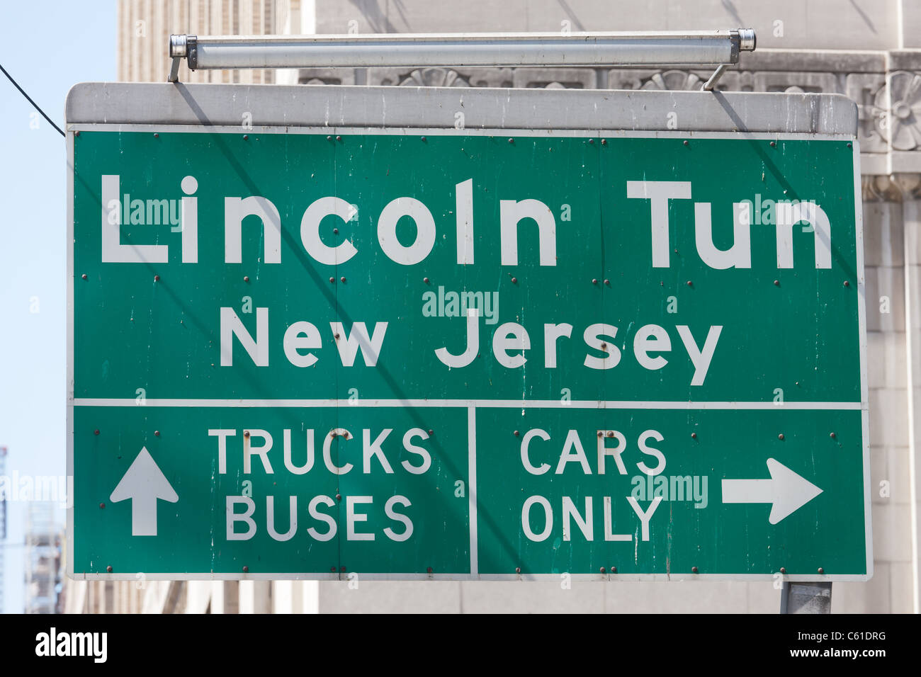 Sign directing trucks, buses, and cars to the correct lane for entrance