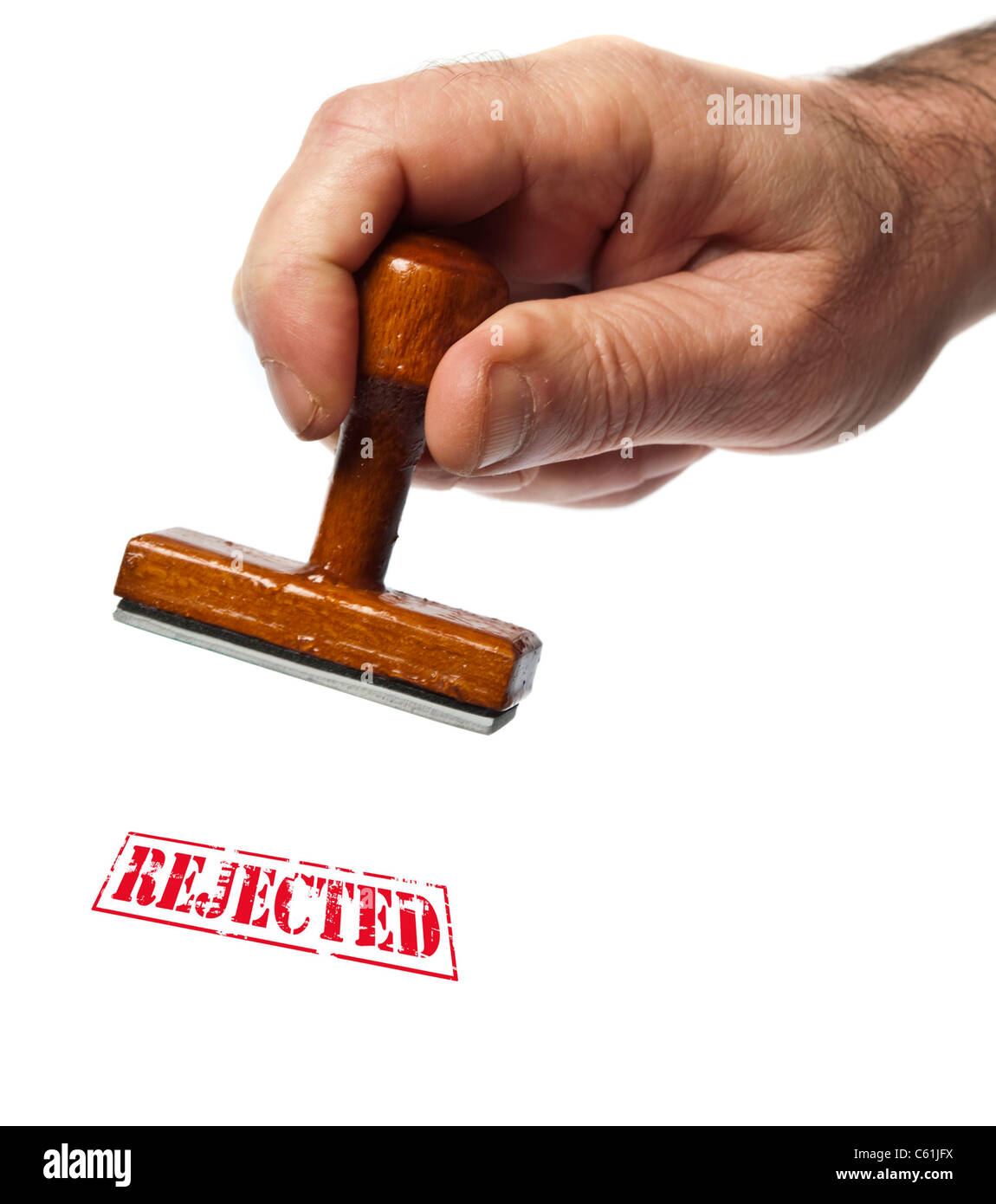 Rejected stamp in male hand Stock Photo