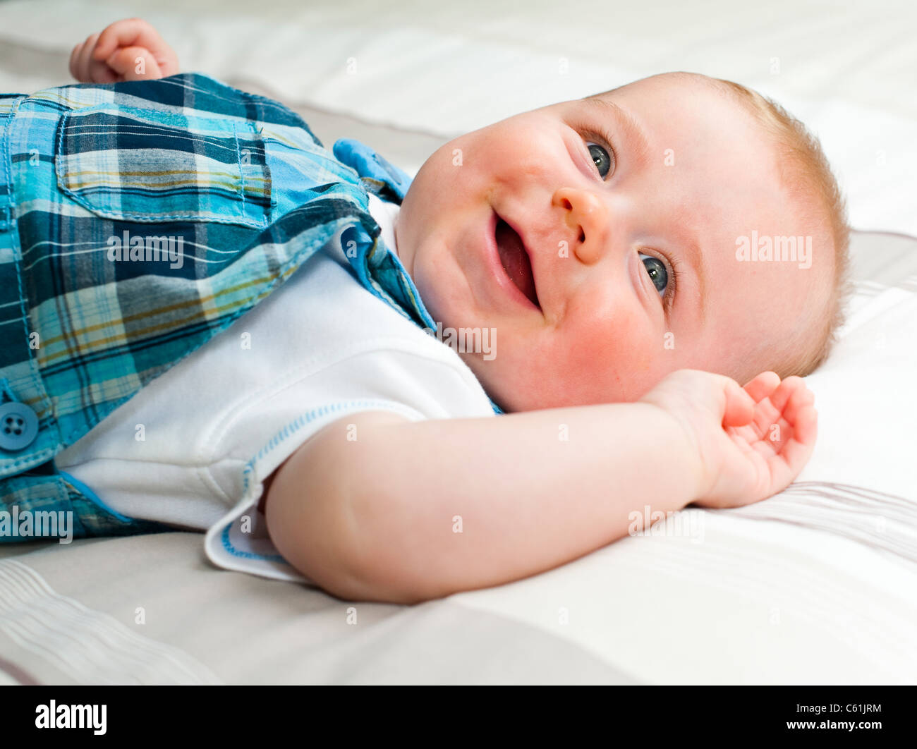 Happy five months old baby boy laughing Stock Photo