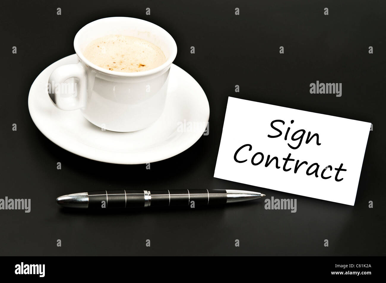 Sign contract message on desk with coffee Stock Photo Alamy