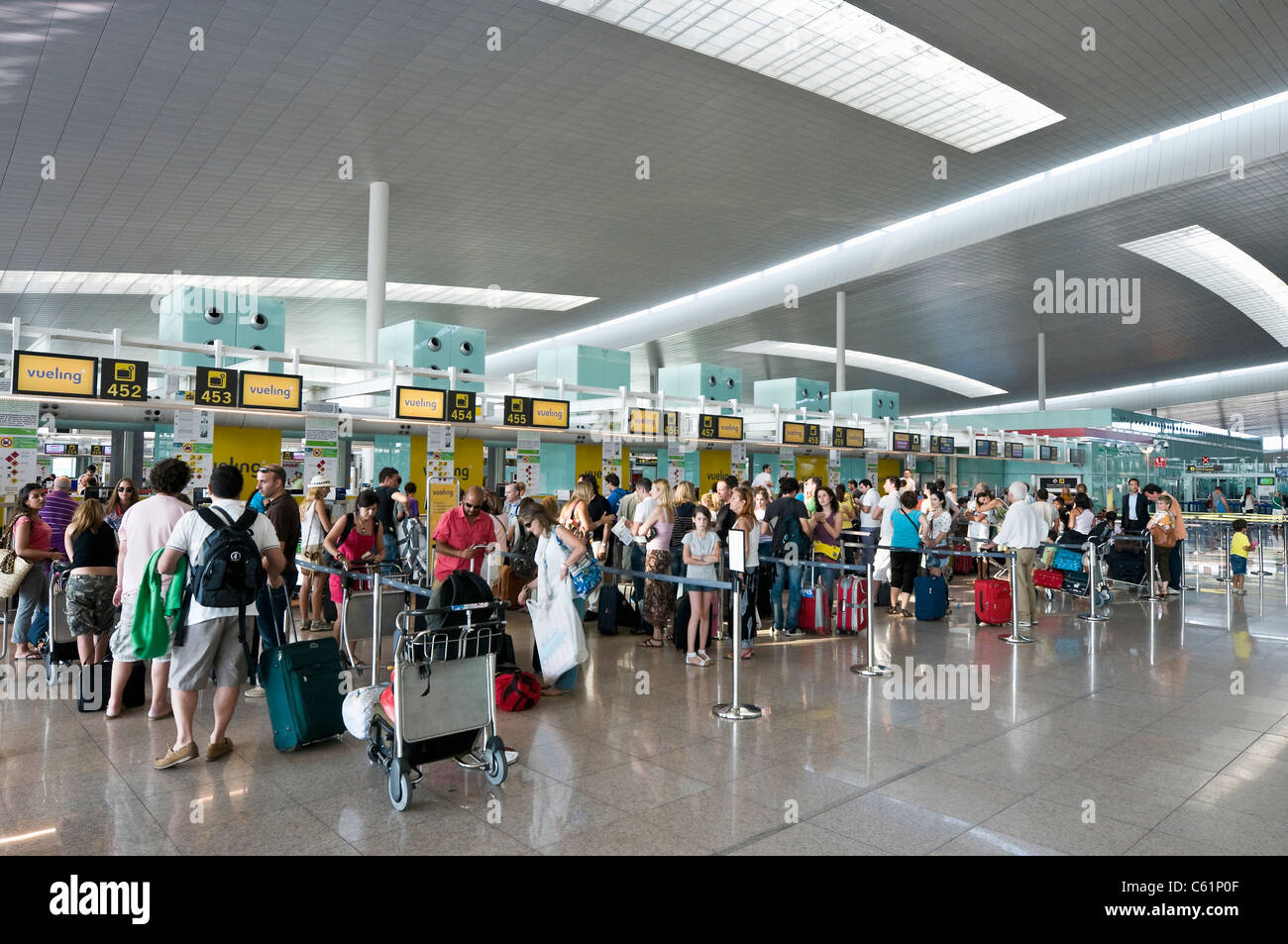 Passengers waiting to check in at Terminal 1, Barcelona El Prat Airport