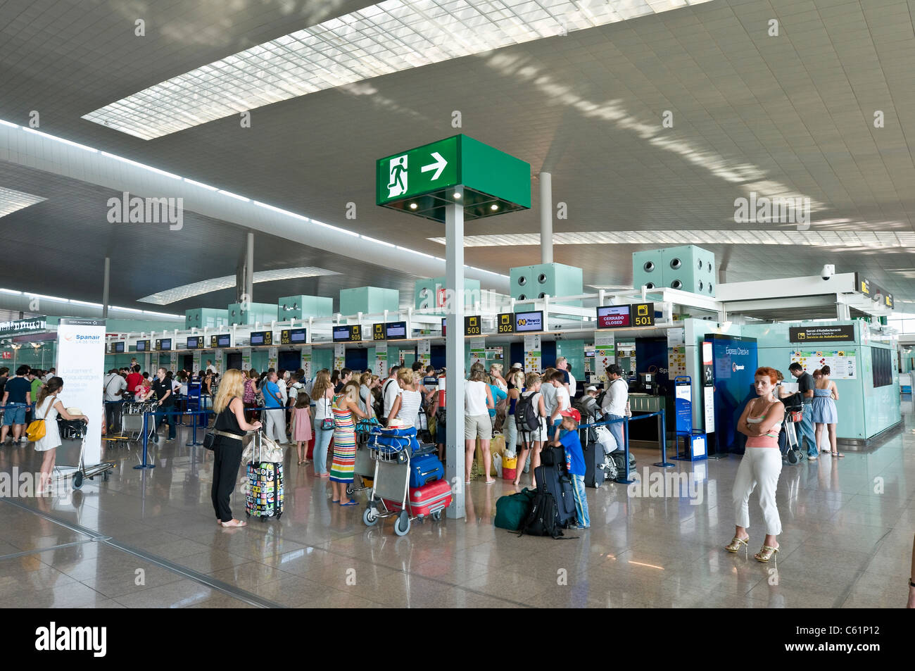 Passengers waiting to check in at Terminal 1, Barcelona El Prat Airport