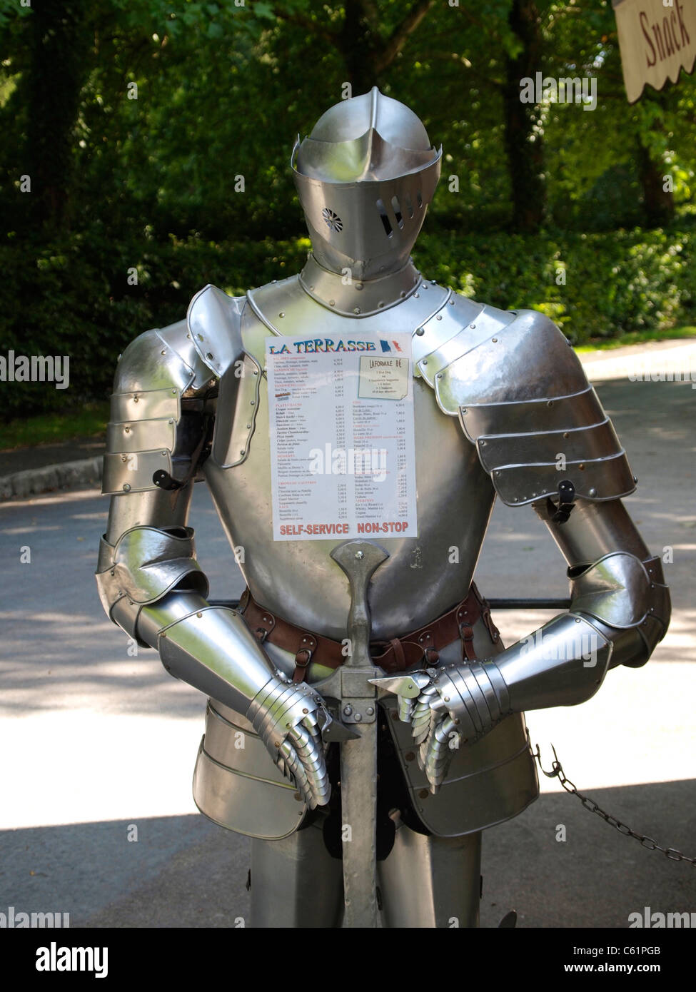 Knights armor harness carrying the menu of a restaurant at Chateau Royal de Chambord, Loire valley, France Stock Photo