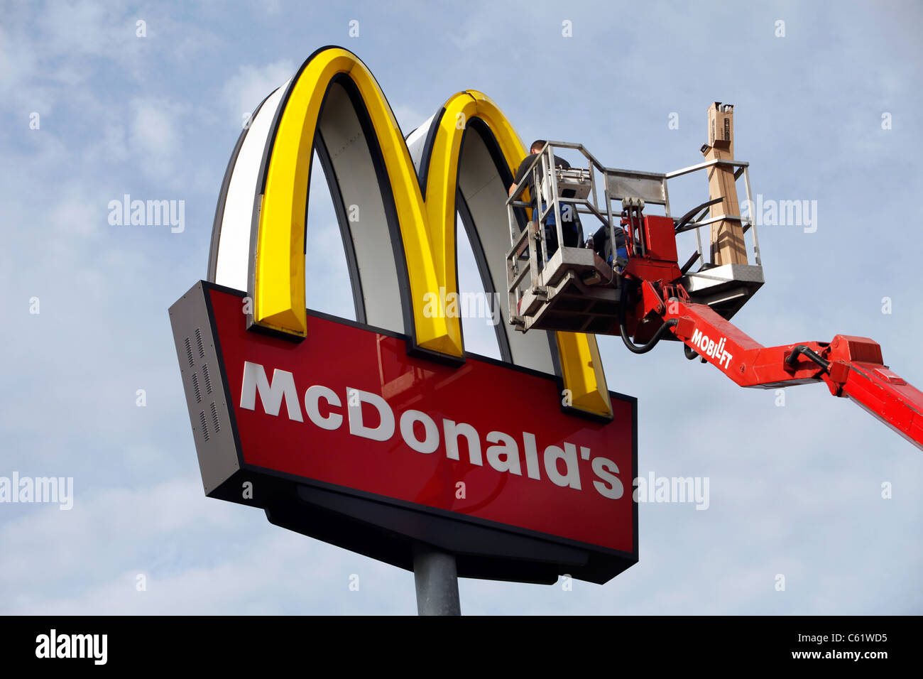 Repair of a McDonald's Restaurant neon sign Stock Photo - Alamy