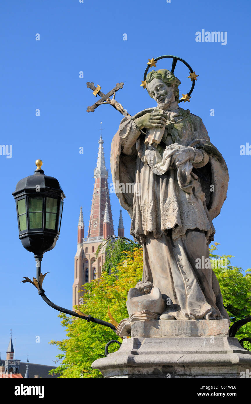 Bruges / Brugge, Flanders, Belgium. Statue of St John Nepomuk on bridge on Wollestraat Stock Photo