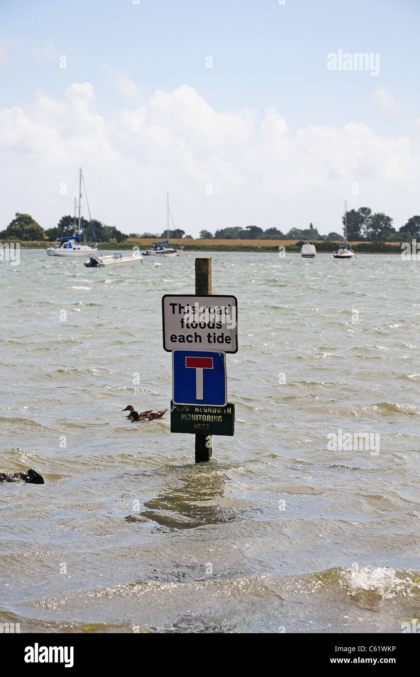 Warning sign about tides in Bosham. Stock Photo