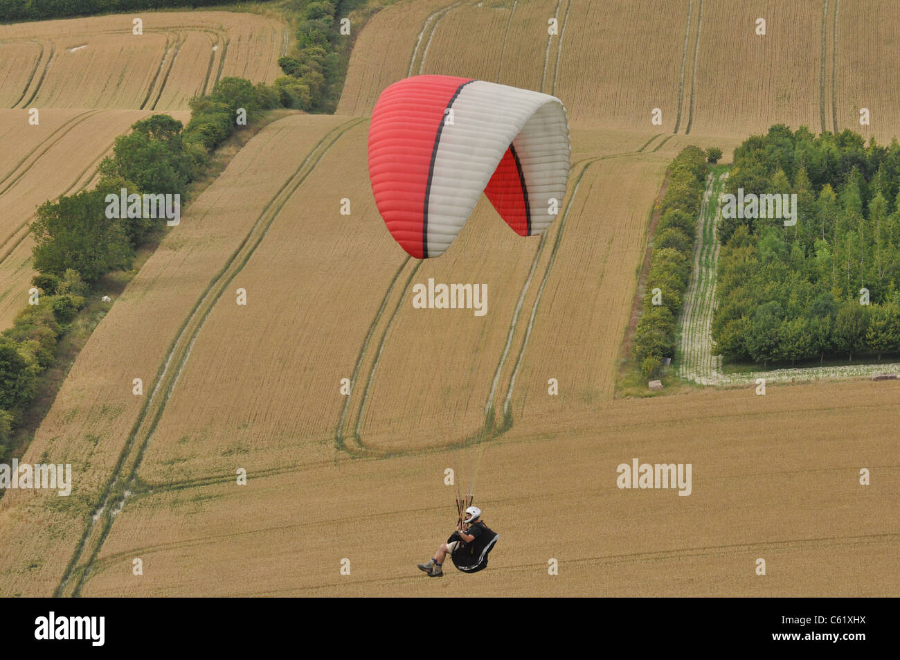 Hang Glider over stubble fields Stock Photo