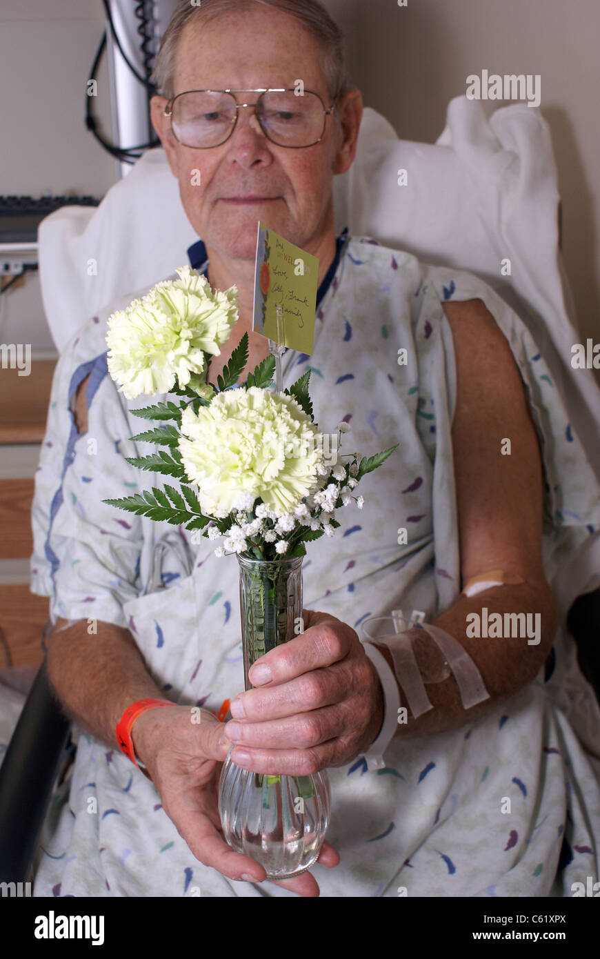 Hospital patient with flowers Stock Photo Alamy