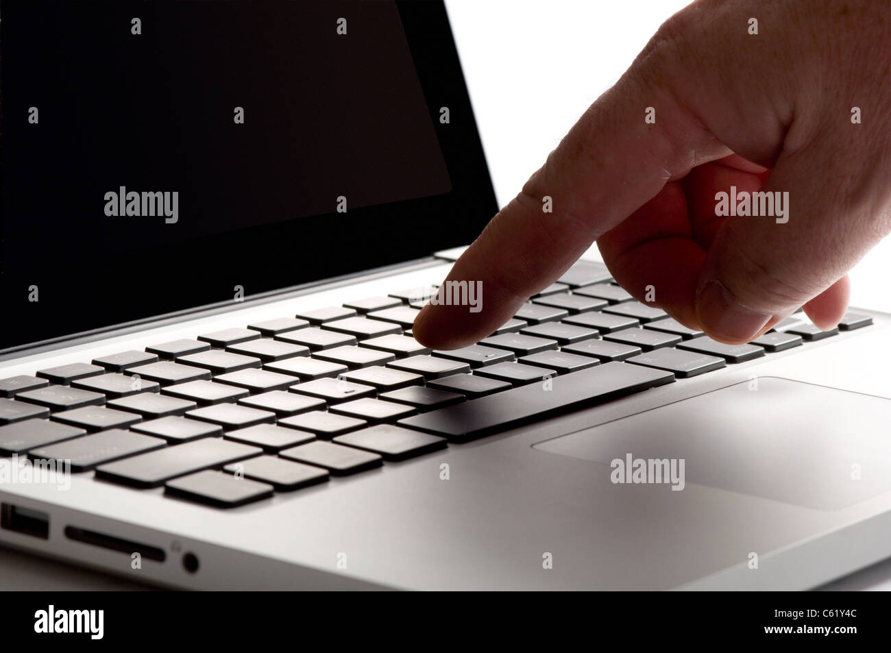Finger touching mouse pad on laptop Stock Photo Alamy