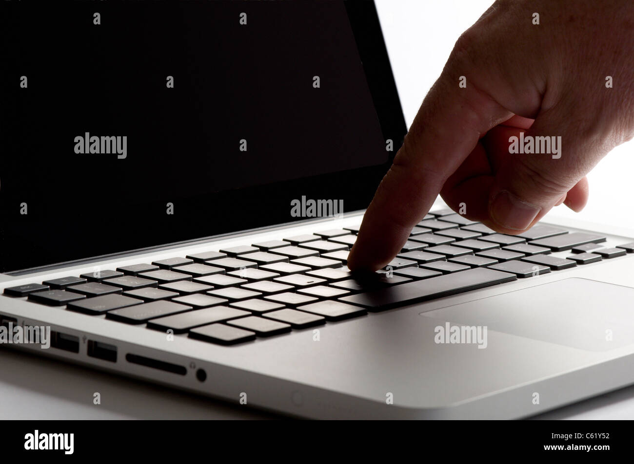 Finger touching mouse pad on laptop Stock Photo Alamy