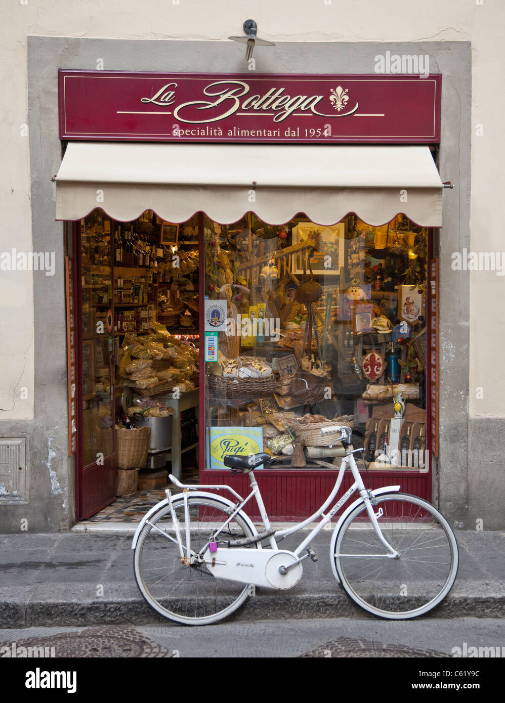 Alimentiri, grocery store with bicycle parked, Florence, Italy Stock Photo