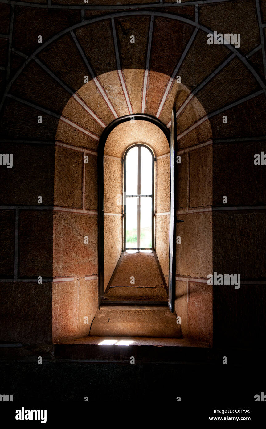 Sunlit Stone Arched Church Window - Interior Stock Photo