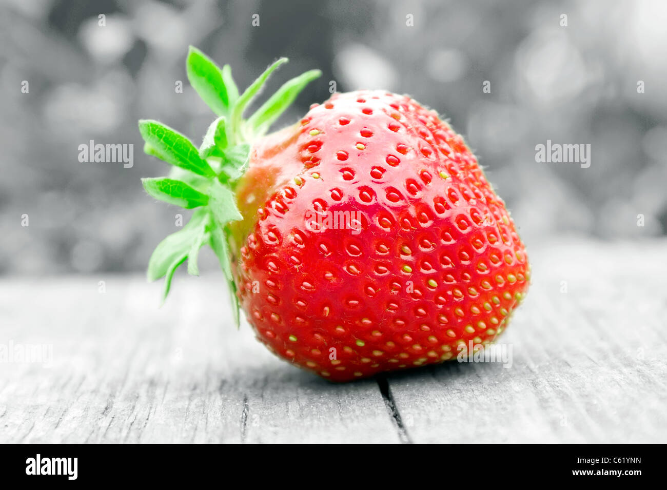 juicy strawberry on black and white Stock Photo - Alamy