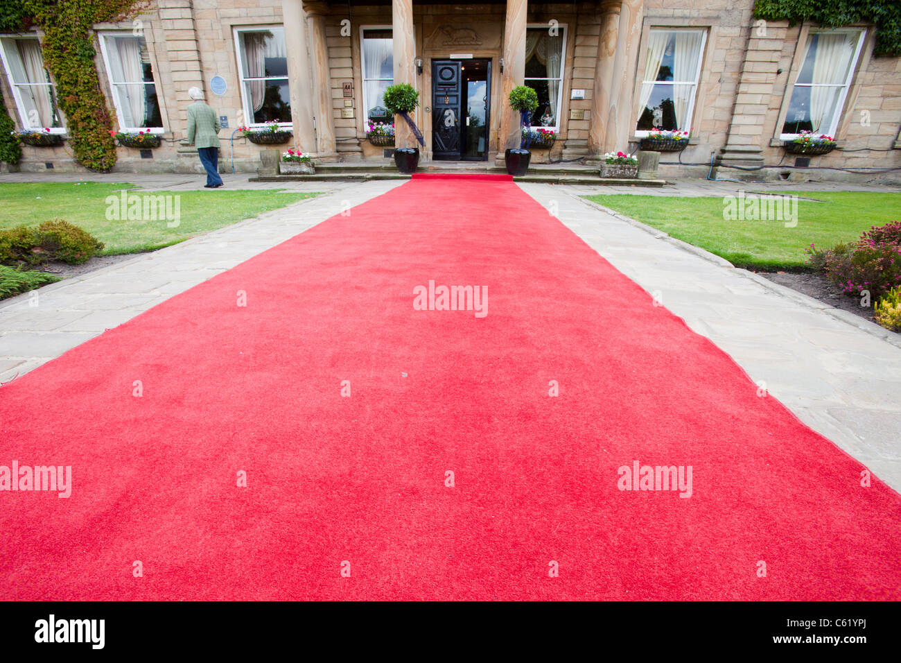 A red carpet leading towards Walton Hall near Wakefield, Yorkshire, UK. Stock Photo