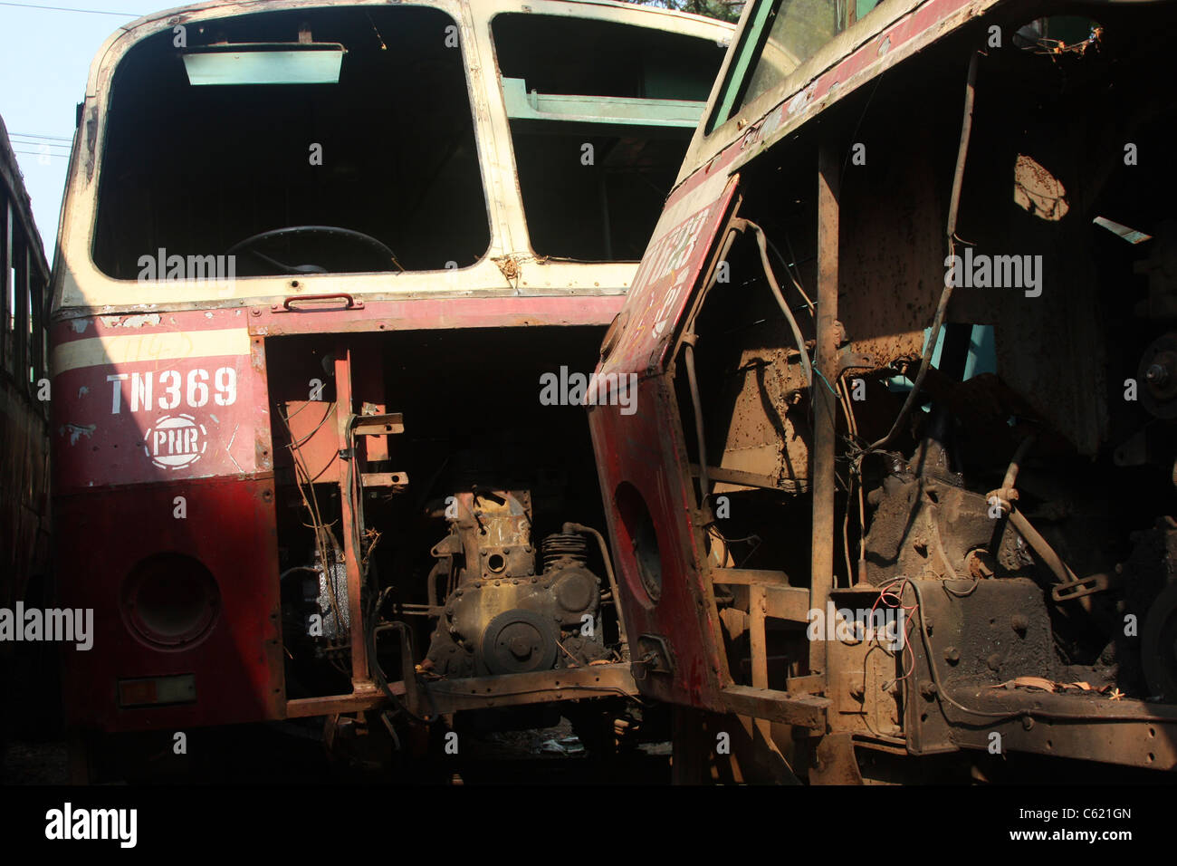 Damaged Leyland Keralan State buses awaiting repair or scrap in Kerala India Stock Photo