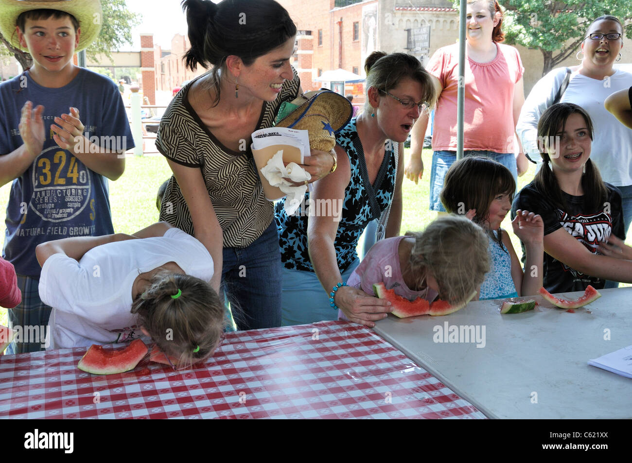 Watermelon eating competition among kids, Stockyards, Fort Worth, Texas, USA Stock Photo