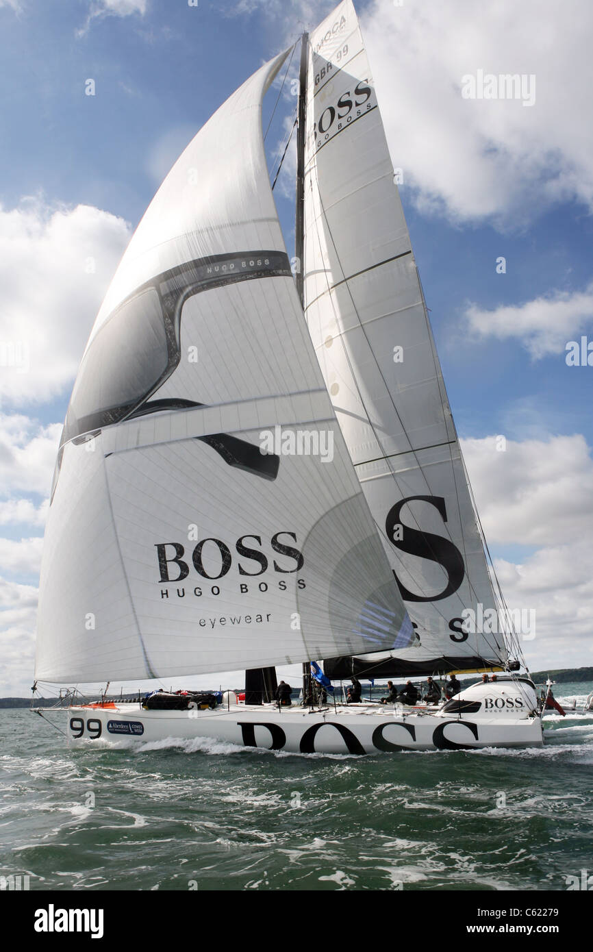 COWES, ISLE OF WIGHT - Ewan McGregor sails on Hugo Boss skippered by Alex Thomson in the 2011 Artemis Challenge Stock Photo