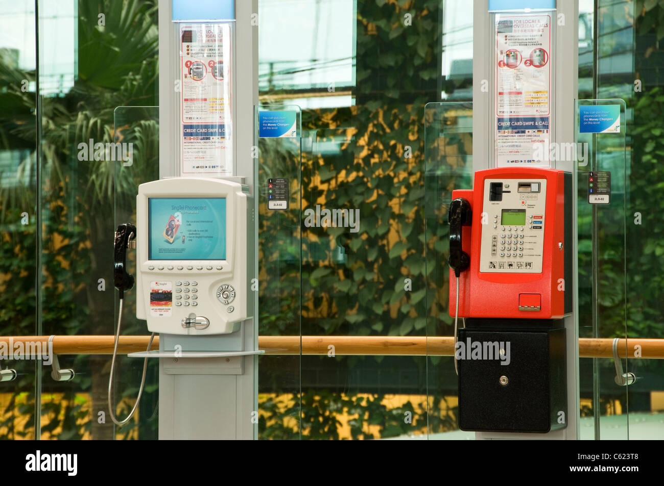 Public payphones in the landside departure hall, Changi Airport Terminal 3, Singapore Stock Photo