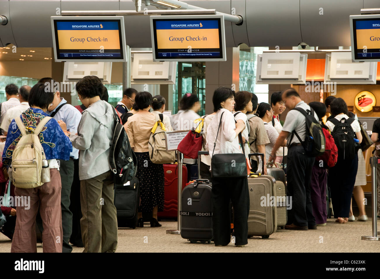 Singapore Airlines group check-in counters, departure hall at Changi Airport Terminal 3, Singapore Stock Photo