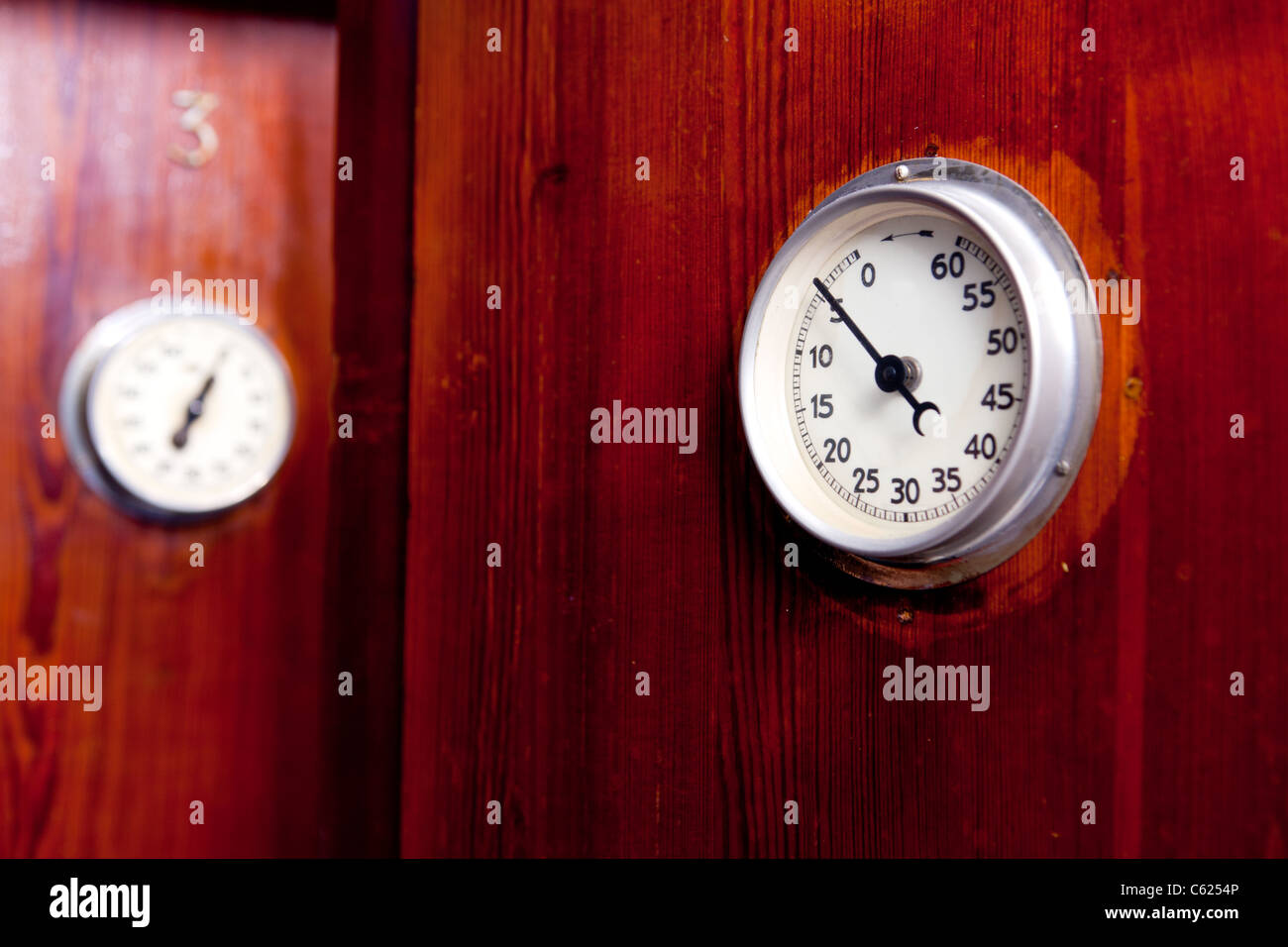 Two doors from an old style spa with retro hourly timer stock photo alamy