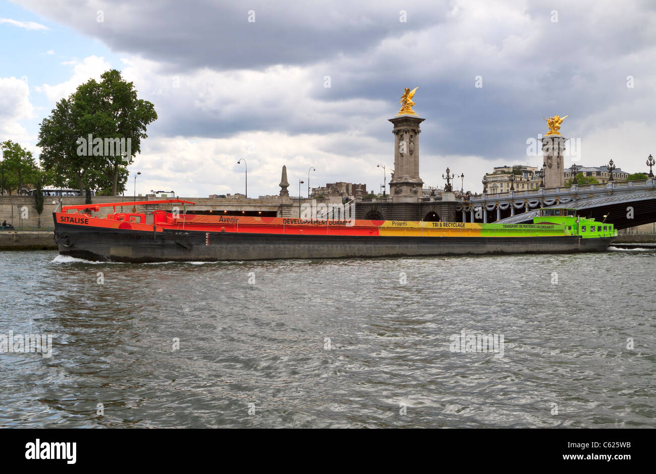 Inland Dry Cargo Vessel Sitalise on the River Seine in Paris. Recyclables are transported to recovery plants via river barge. Stock Photo