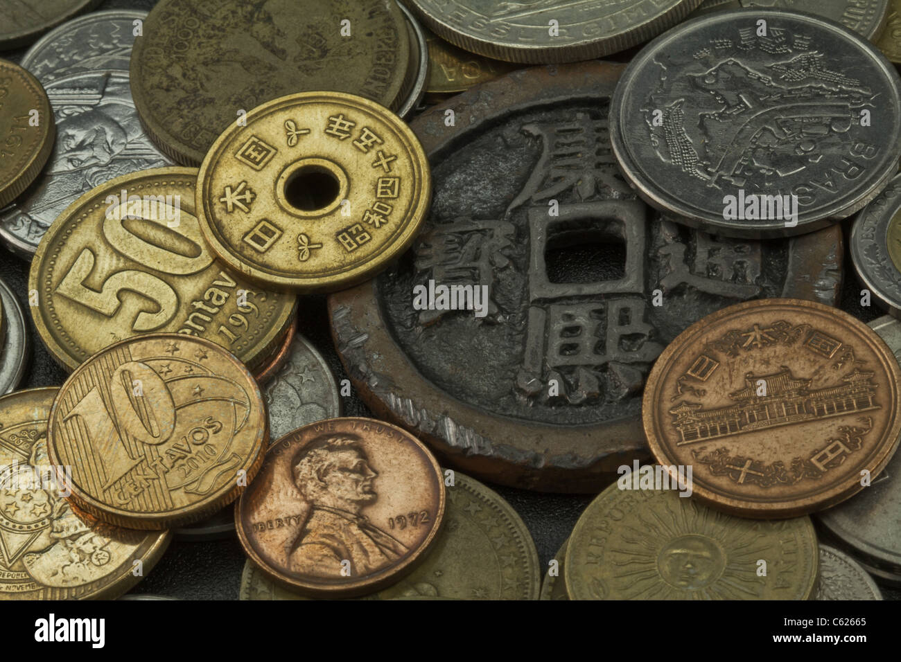 Old coins of several countries and colors Stock Photo