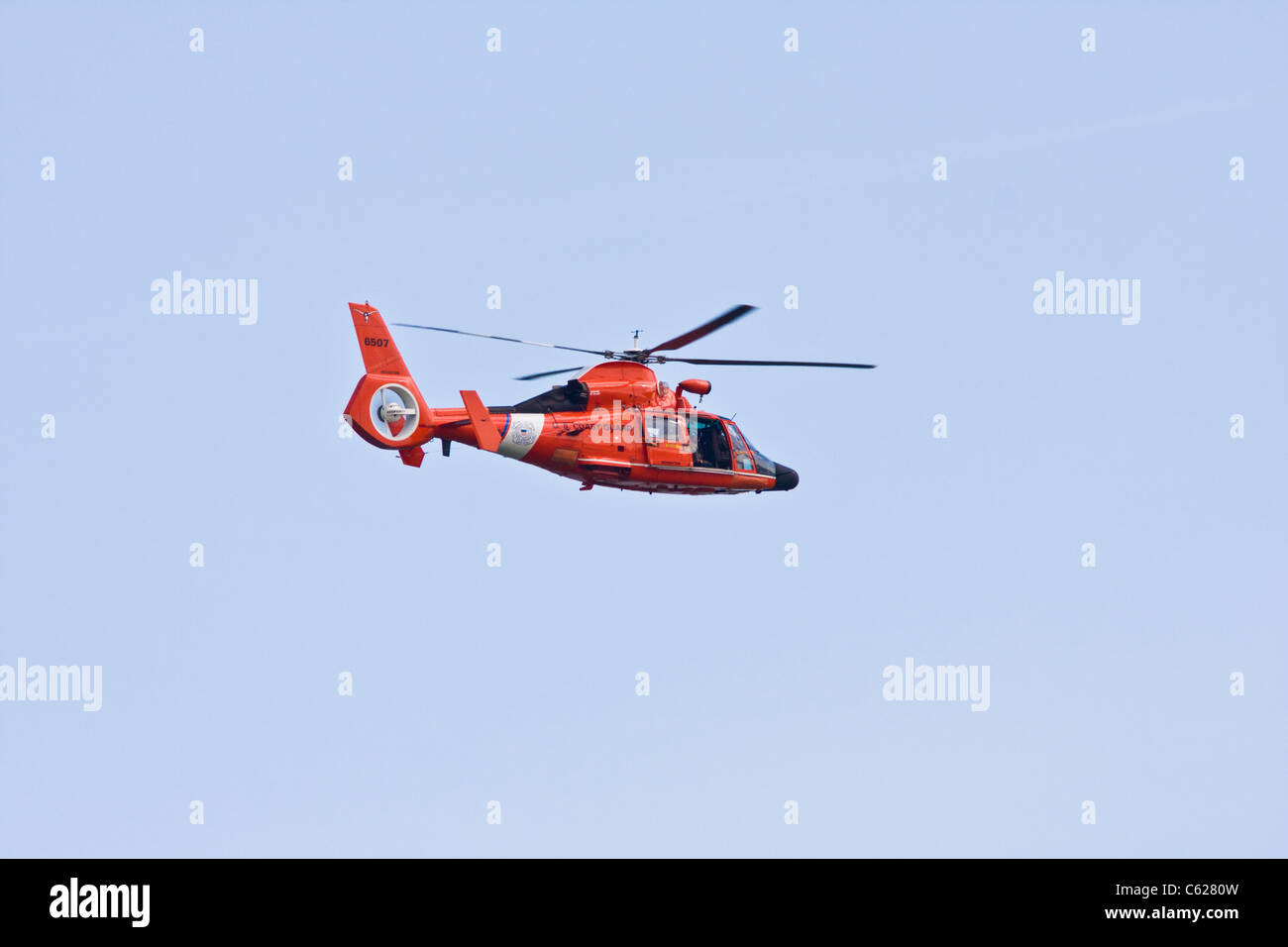 US Coast Guard helicopter over Texas City bay. Stock Photo