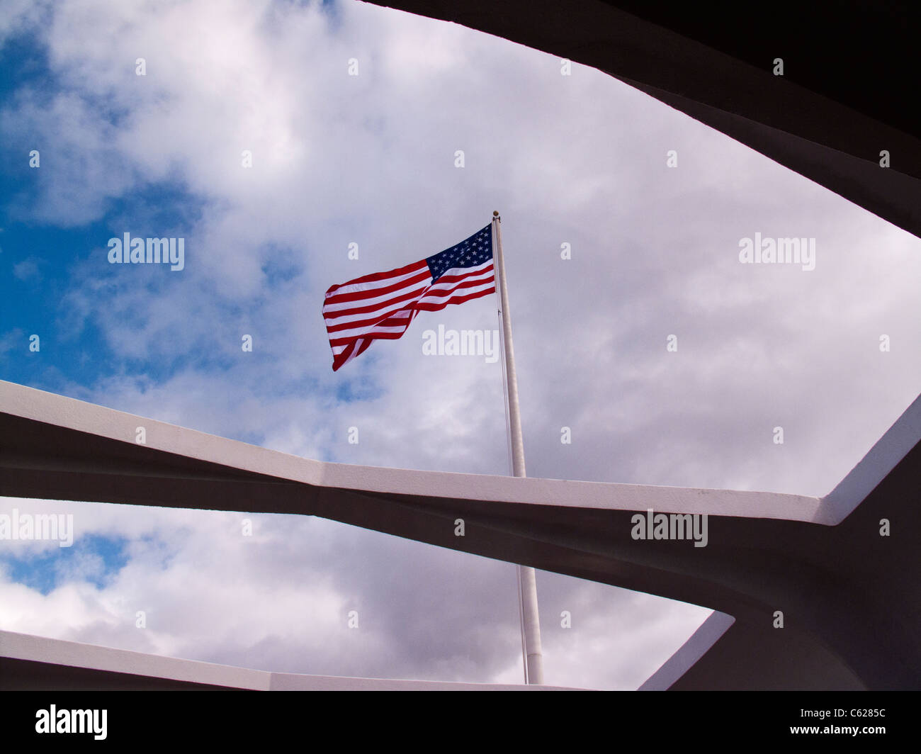 Flag seen from Arizona Memorial at Pearl Harbor Stock Photo