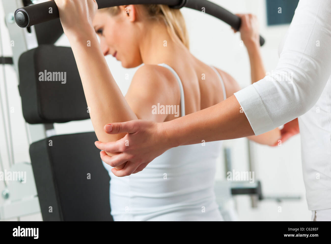 Patient at the physiotherapy making physical exercises Stock Photo