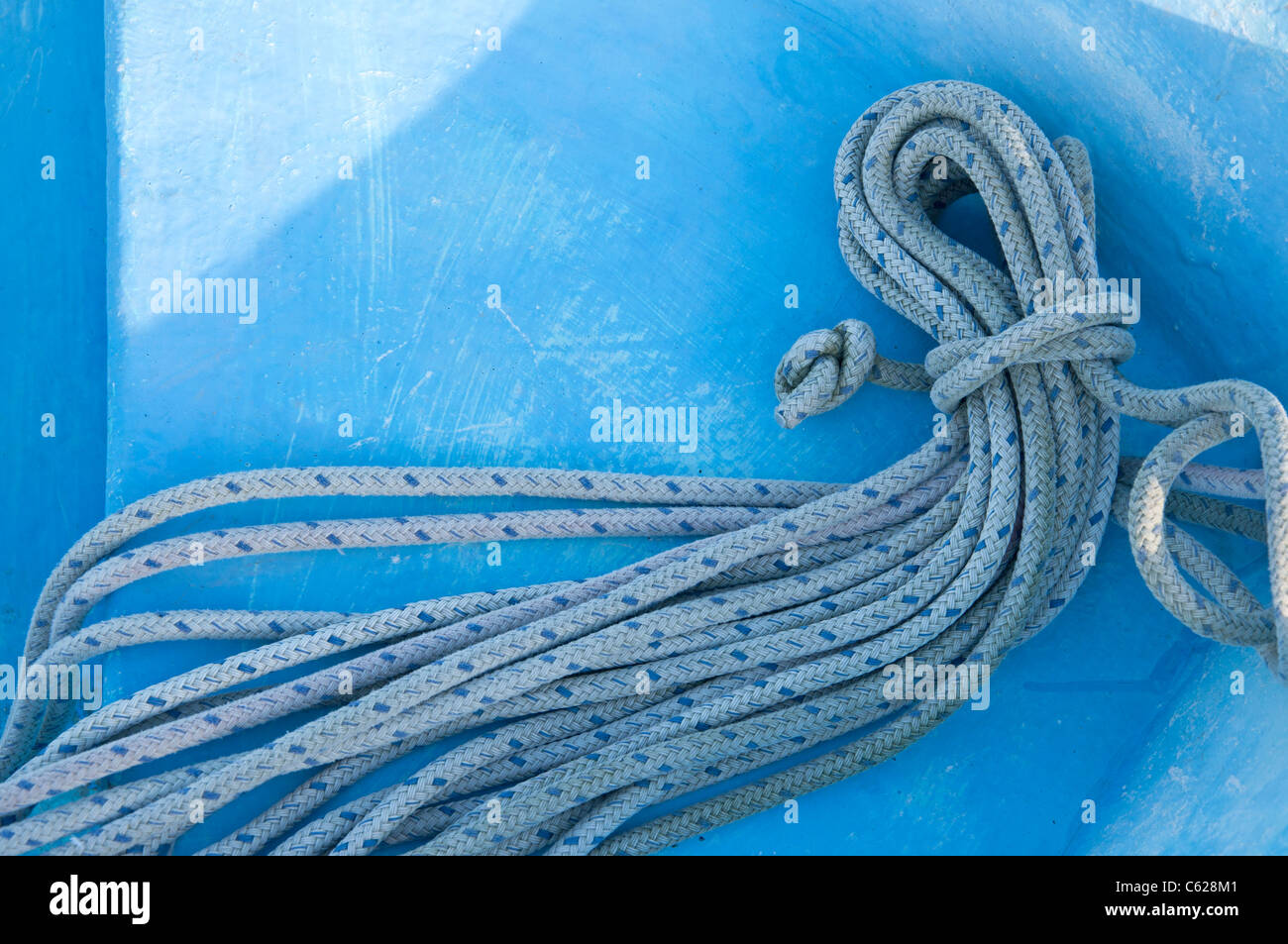 sailing rope coiled on deck of boat Stock Photo
