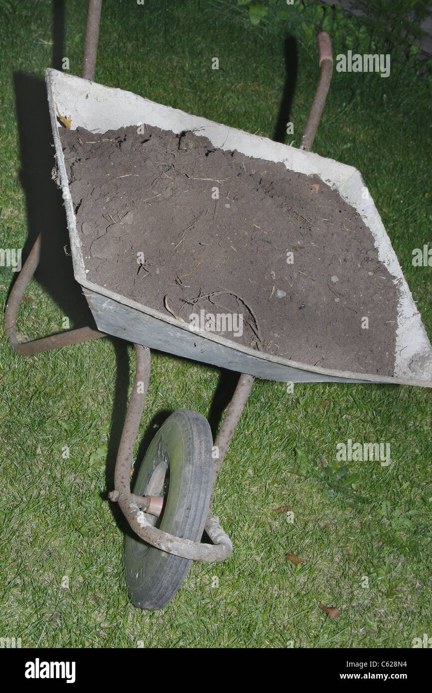 image of old wheelbarrow full of soil Stock Photo - Alamy