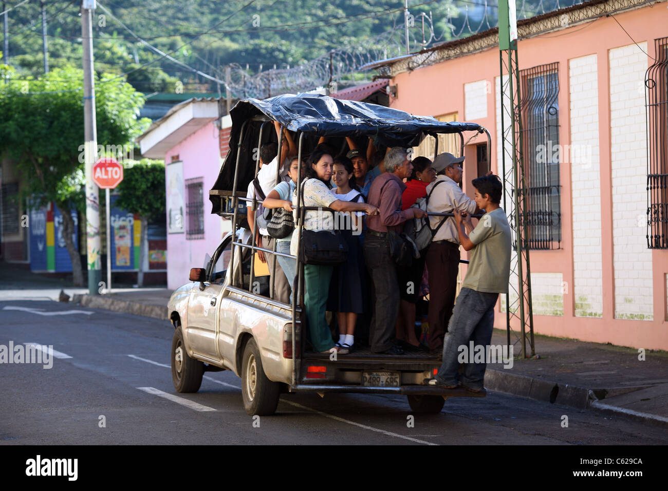 Passengers overload public transport Juayua, El Salvador Stock Photo