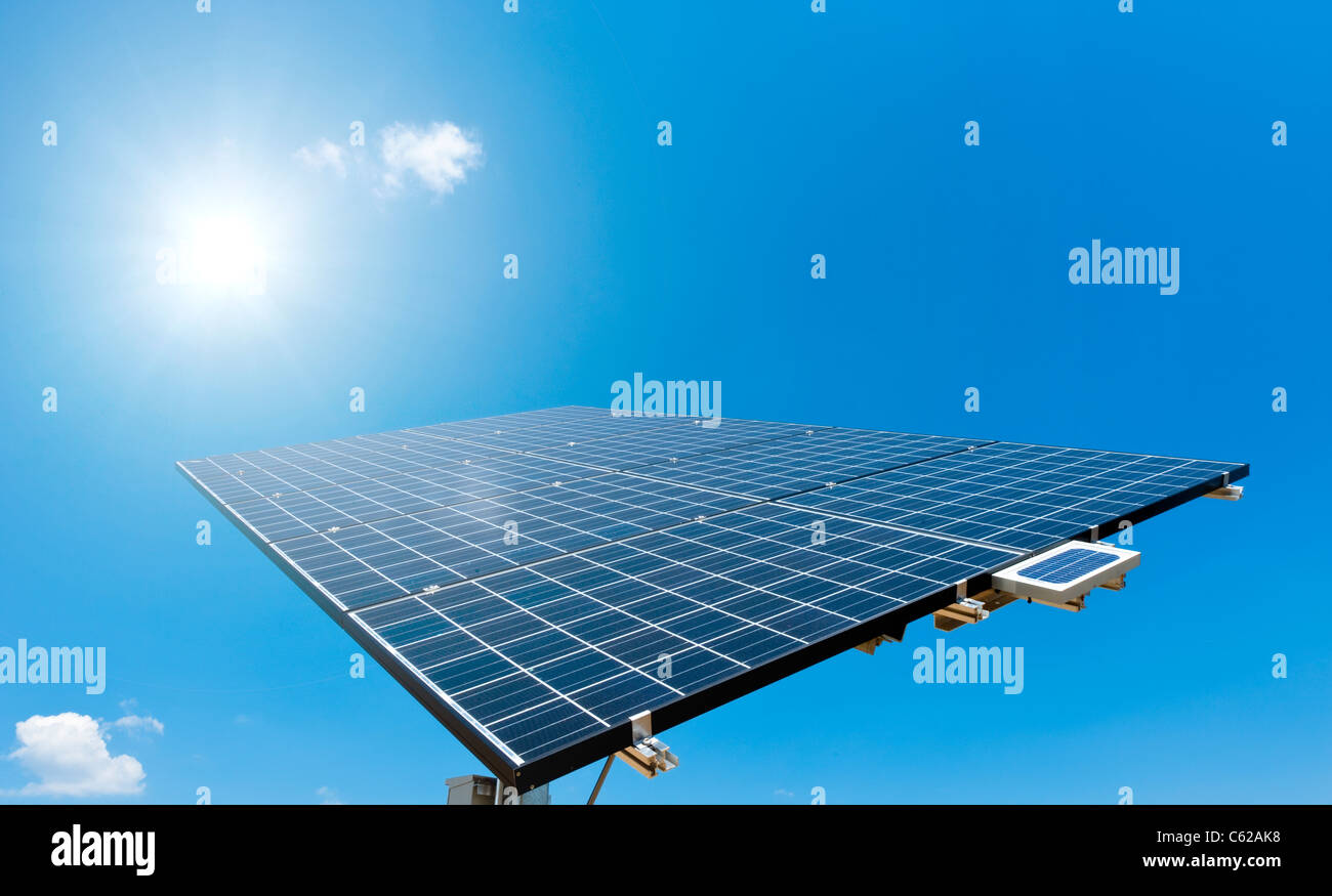 Sun shines on Solar Panel with blue Sky Stock Photo - Alamy