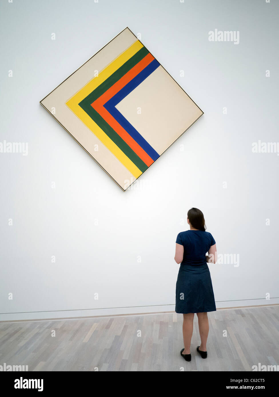 Woman looking at painting Swing by Kenneth Noland at K20 art museum or Kunstsammlung at Grabbeplatz Dusseldorf Germany Stock Photo