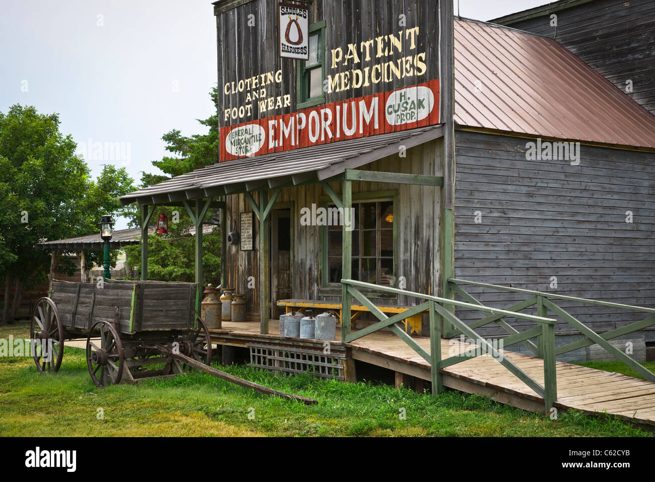 1880 historic wild west town in South Dakota near Murdo. Old general store and wooden wagon horizontal hi-res Stock Photo