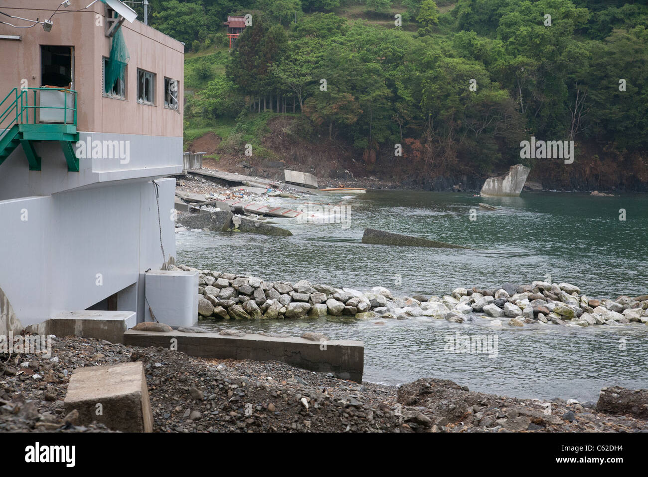A failed seawall destroyed by the tsunami in Japan. Stock Photo
