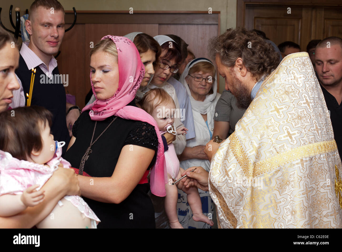 Baby Baptism In Russian Orthodox Church. Priest Christening The Little ...